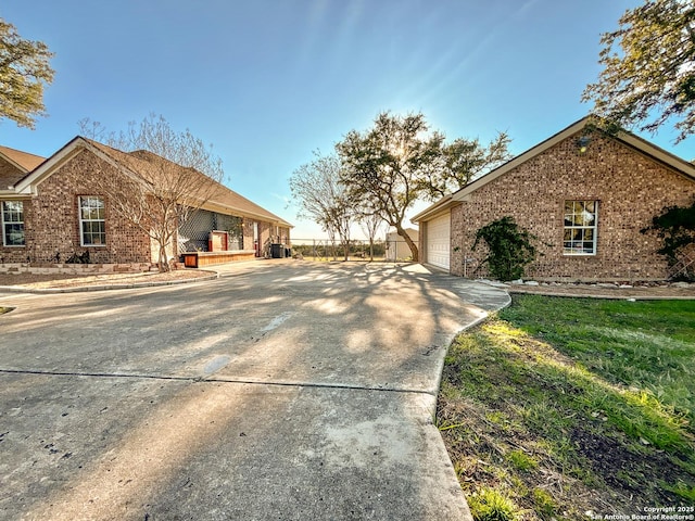 view of side of home with a garage