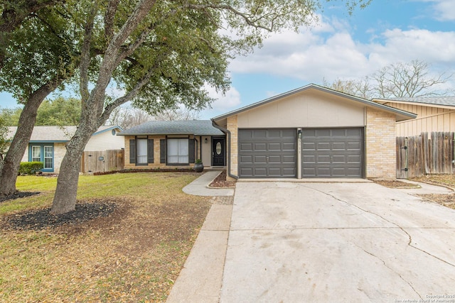 single story home with a garage and a front yard