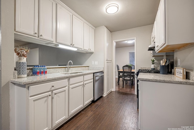 kitchen with light stone countertops, sink, white cabinetry, and appliances with stainless steel finishes