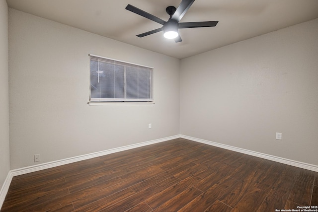 spare room featuring ceiling fan and dark wood-type flooring