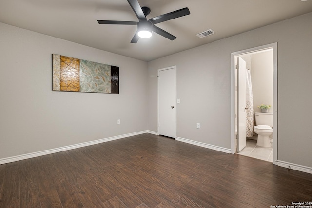 unfurnished bedroom featuring ceiling fan, hardwood / wood-style flooring, and ensuite bath