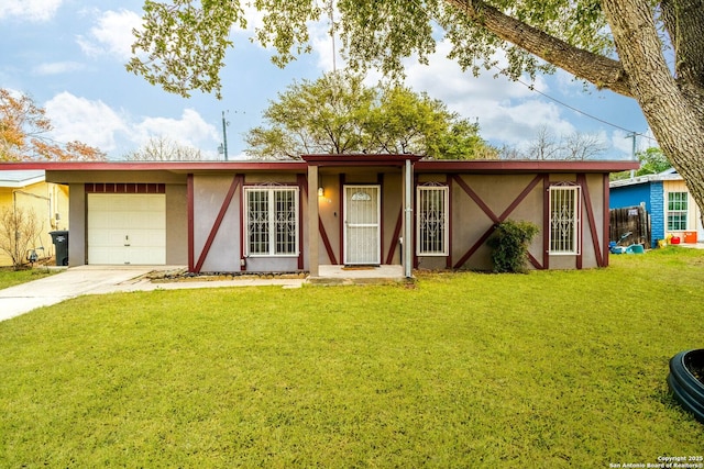 single story home featuring a front lawn and a garage