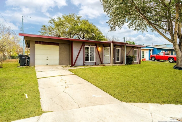 ranch-style home with a garage and a front lawn