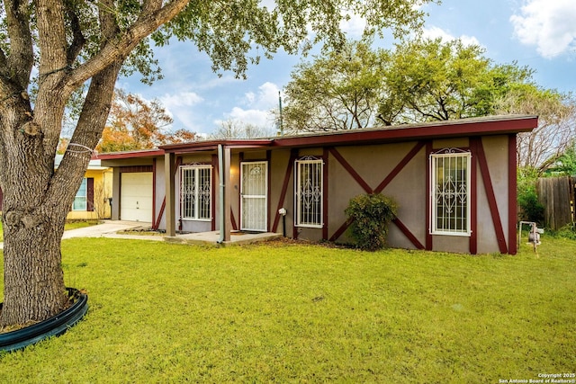 back of property featuring a yard and a garage