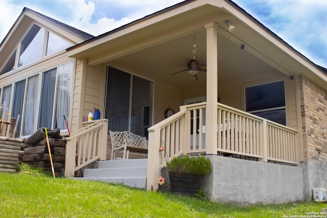 exterior space with ceiling fan and a porch