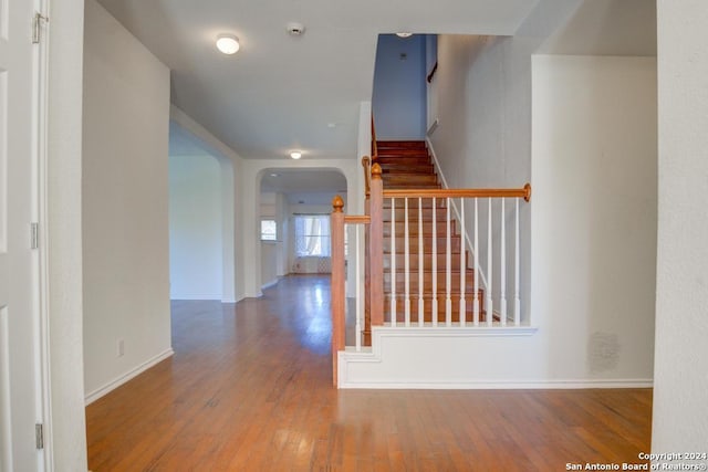 hall with hardwood / wood-style floors