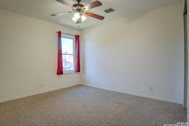 unfurnished room featuring carpet floors and ceiling fan