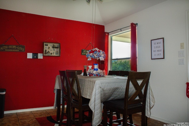 dining space with vaulted ceiling