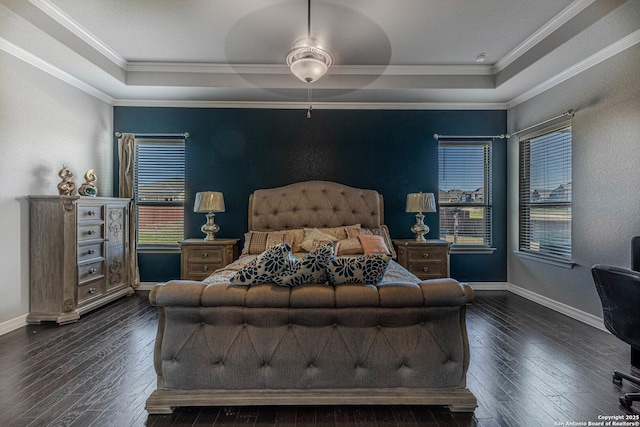 bedroom with ceiling fan, crown molding, and a raised ceiling