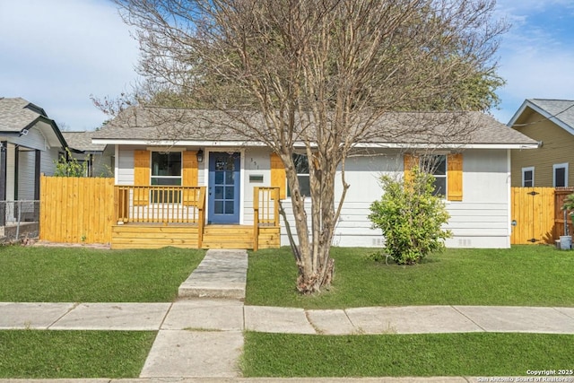 bungalow-style house featuring a front yard