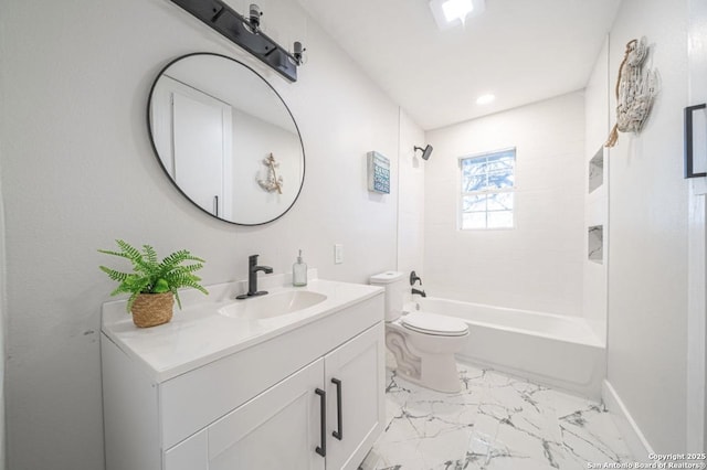 full bathroom featuring toilet, tiled shower / bath, and vanity