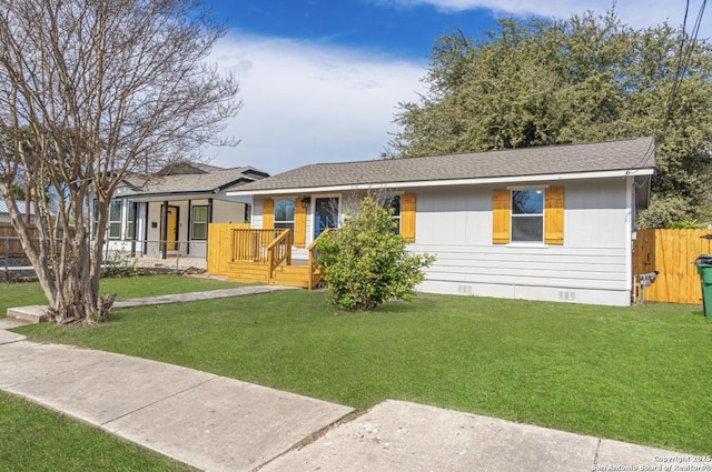 single story home with covered porch and a front yard