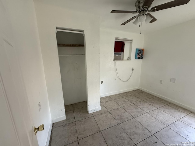 unfurnished bedroom with ceiling fan, light tile patterned floors, and cooling unit