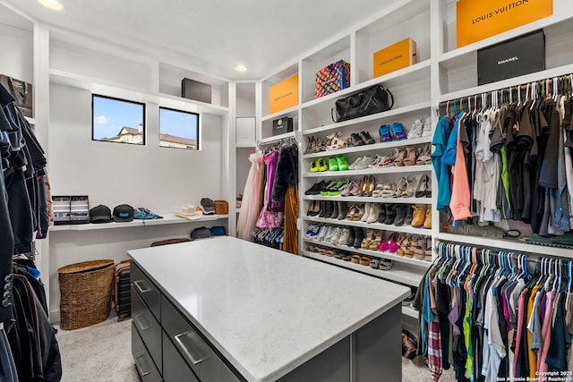 spacious closet with light colored carpet