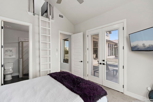 carpeted bedroom featuring lofted ceiling, connected bathroom, french doors, access to outside, and ceiling fan