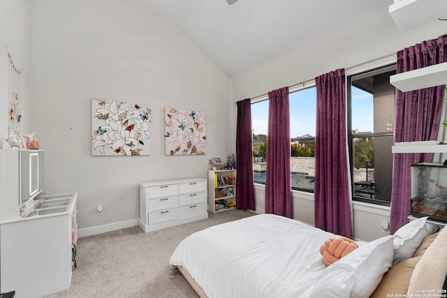 carpeted bedroom with vaulted ceiling