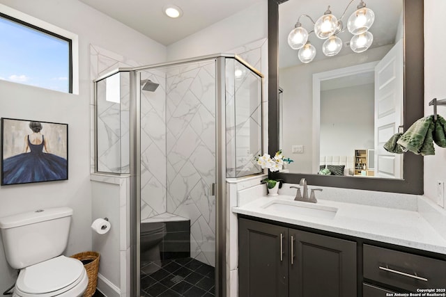 bathroom featuring toilet, walk in shower, and vanity