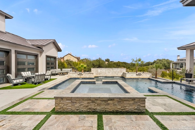 view of pool featuring an in ground hot tub, an outdoor hangout area, and a patio