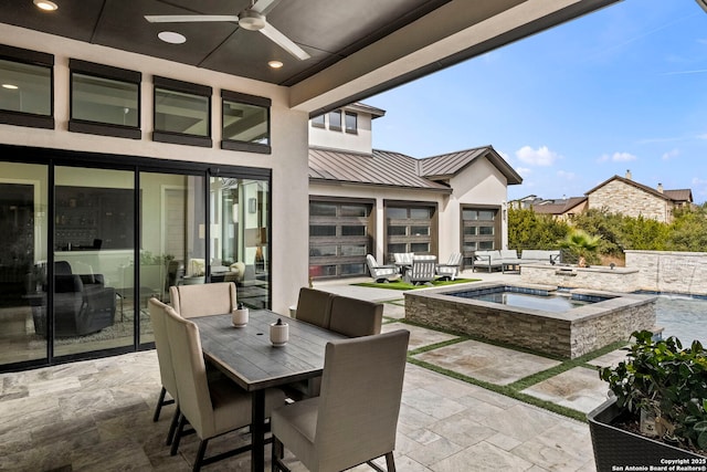 view of patio with ceiling fan, a swimming pool with hot tub, and outdoor lounge area