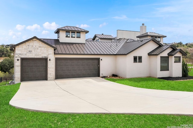 modern farmhouse featuring a front yard and a garage