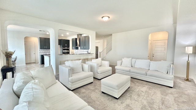 living room featuring light colored carpet