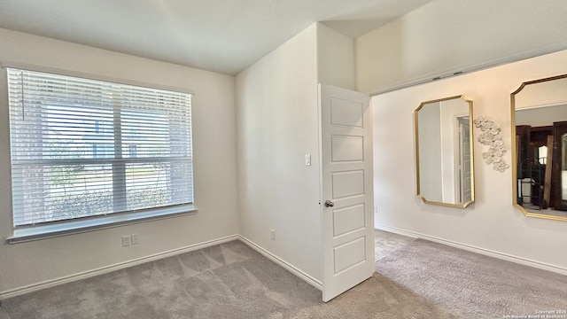 unfurnished room with carpet flooring