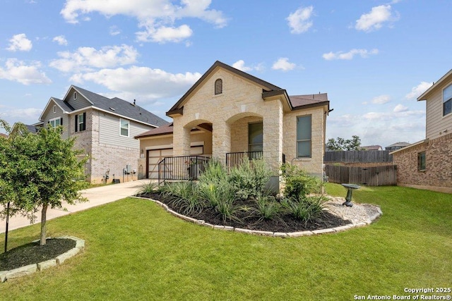 view of front of property with a garage and a front yard