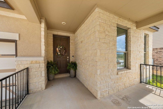 doorway to property featuring a balcony