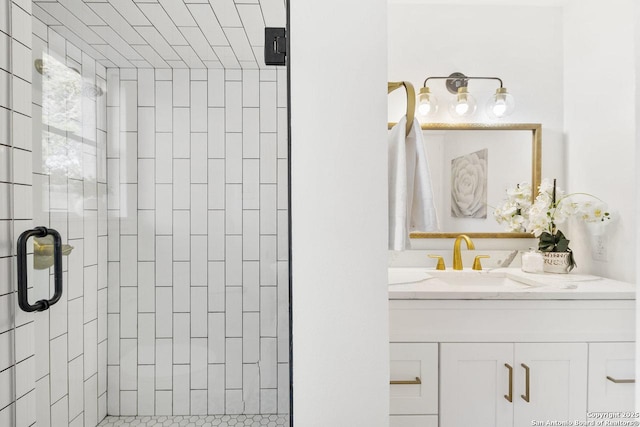 bathroom featuring an enclosed shower and vanity