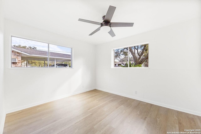 spare room featuring ceiling fan and light hardwood / wood-style flooring