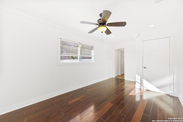 unfurnished room with ceiling fan, ornamental molding, and dark hardwood / wood-style floors