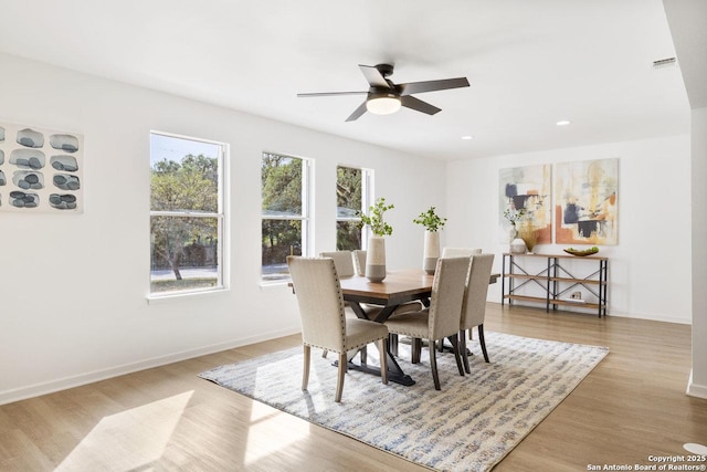 dining area featuring ceiling fan and light hardwood / wood-style floors