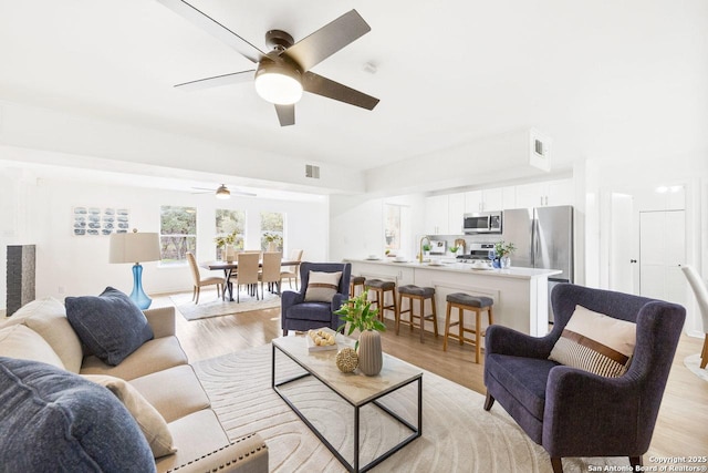 living room featuring light wood-type flooring