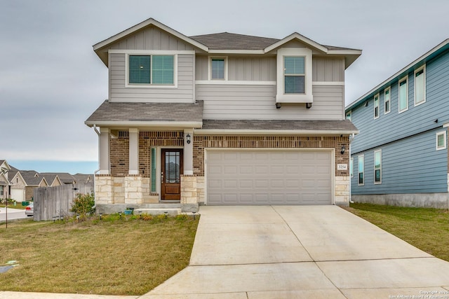 craftsman-style house featuring a garage, a front lawn, and covered porch