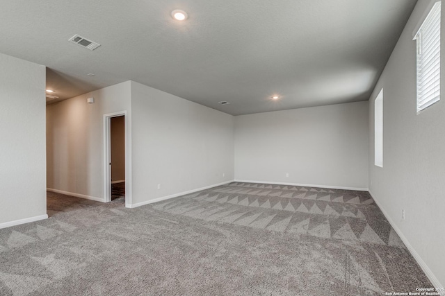 unfurnished room featuring carpet flooring