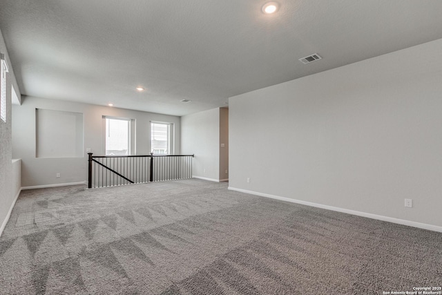 unfurnished room with carpet