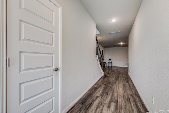 hallway featuring dark wood-type flooring