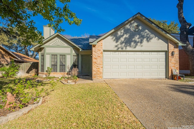 single story home with a garage and a front yard