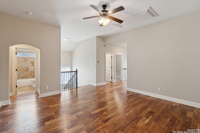 unfurnished room with ceiling fan, dark hardwood / wood-style floors, and lofted ceiling