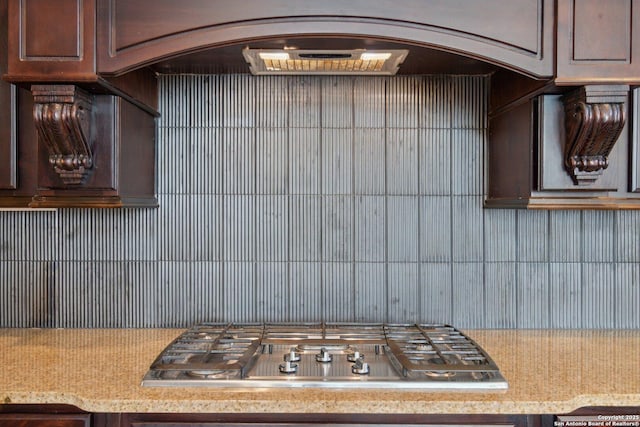 kitchen with dark brown cabinetry and stainless steel gas cooktop