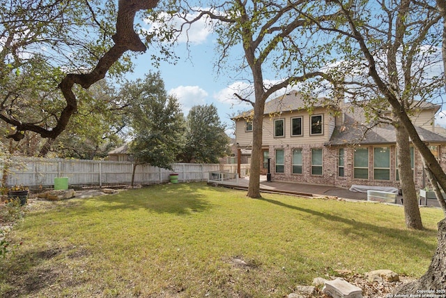 view of yard with a wooden deck