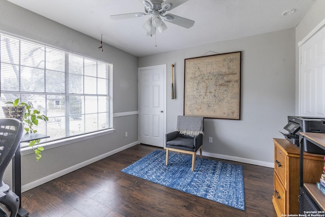 office featuring dark wood-type flooring and ceiling fan