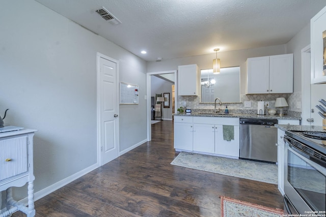 kitchen with white cabinetry, appliances with stainless steel finishes, tasteful backsplash, decorative light fixtures, and sink