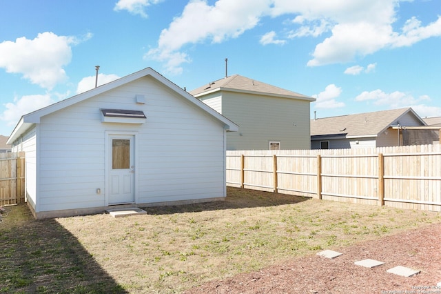 rear view of house with a yard