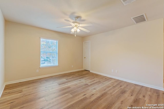 spare room with ceiling fan and light hardwood / wood-style flooring