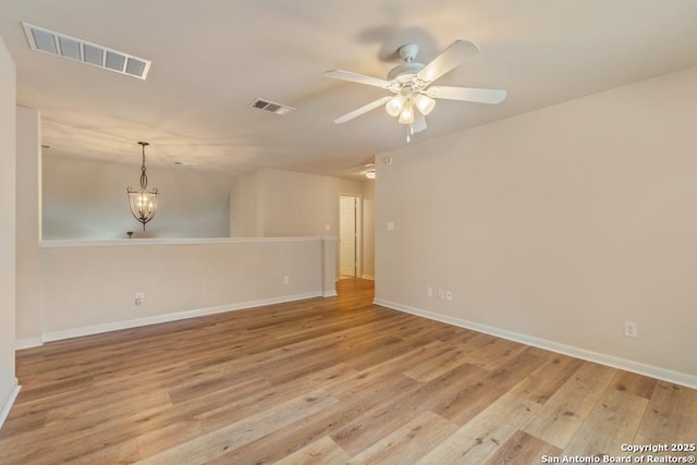 spare room featuring light hardwood / wood-style floors and ceiling fan