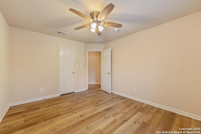 unfurnished room featuring ceiling fan and light hardwood / wood-style floors