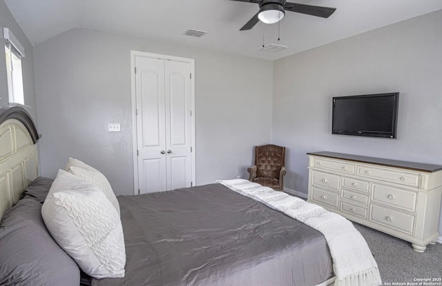 carpeted bedroom featuring ceiling fan, a closet, and lofted ceiling