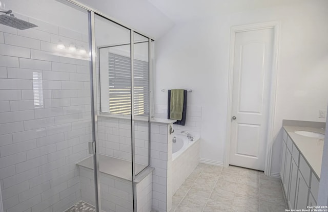 bathroom with tile patterned floors, vanity, lofted ceiling, and shower with separate bathtub