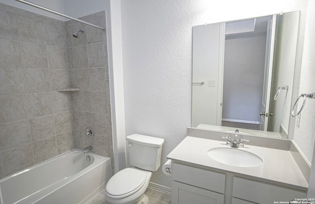 full bathroom with toilet, tiled shower / bath combo, and vanity